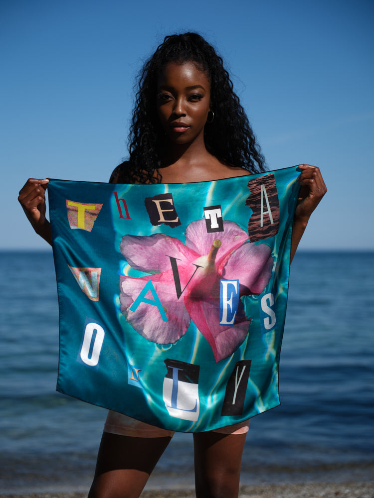 artistic, luxurious silk scarf featuring stunning pinks and blues with poetic collaged text, made in Canada