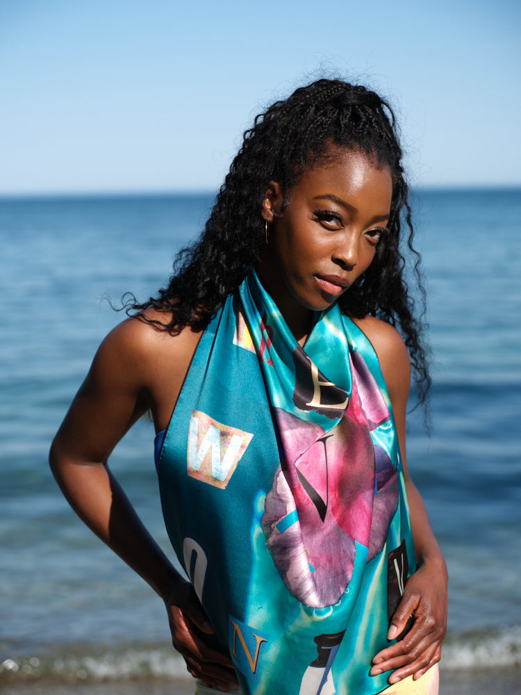 artistic, luxurious silk scarf featuring stunning pinks and blues with poetic collaged text, made in Canada