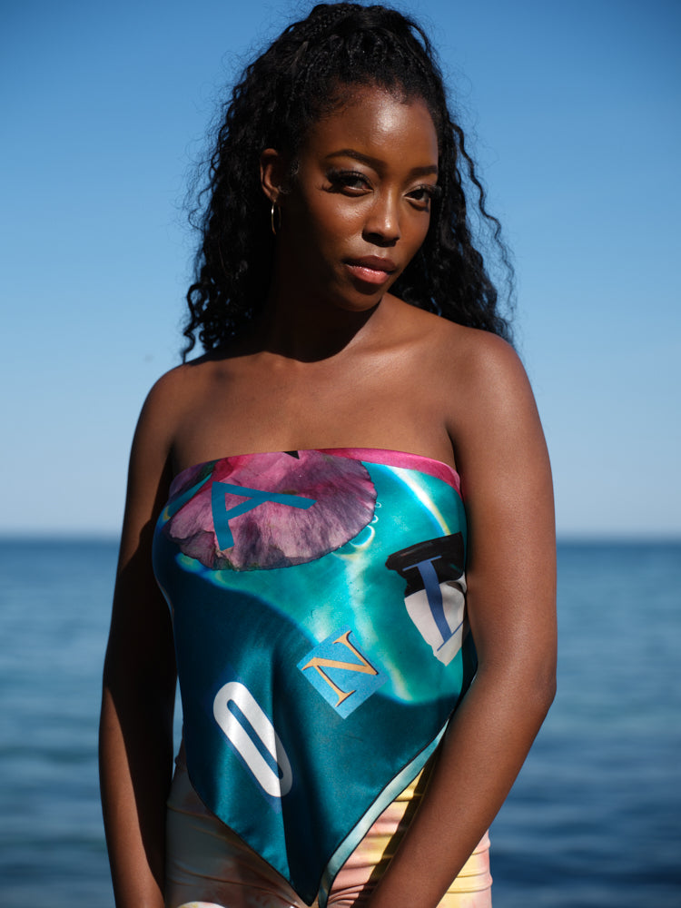 artistic, luxurious silk scarf featuring stunning pinks and blues with poetic collaged text, made in Canada