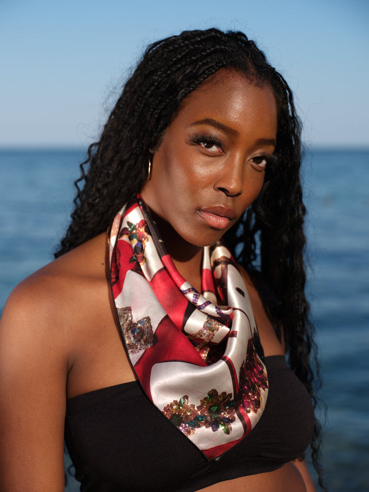 artistic, luxurious silk scarf with original photograph of colourful costume jewellery earrings on red background, made in Canada
