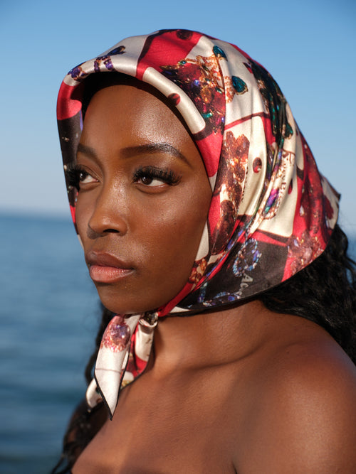 artistic, luxurious silk scarf with original photograph of colourful costume jewellery earrings on red background, made in Canada