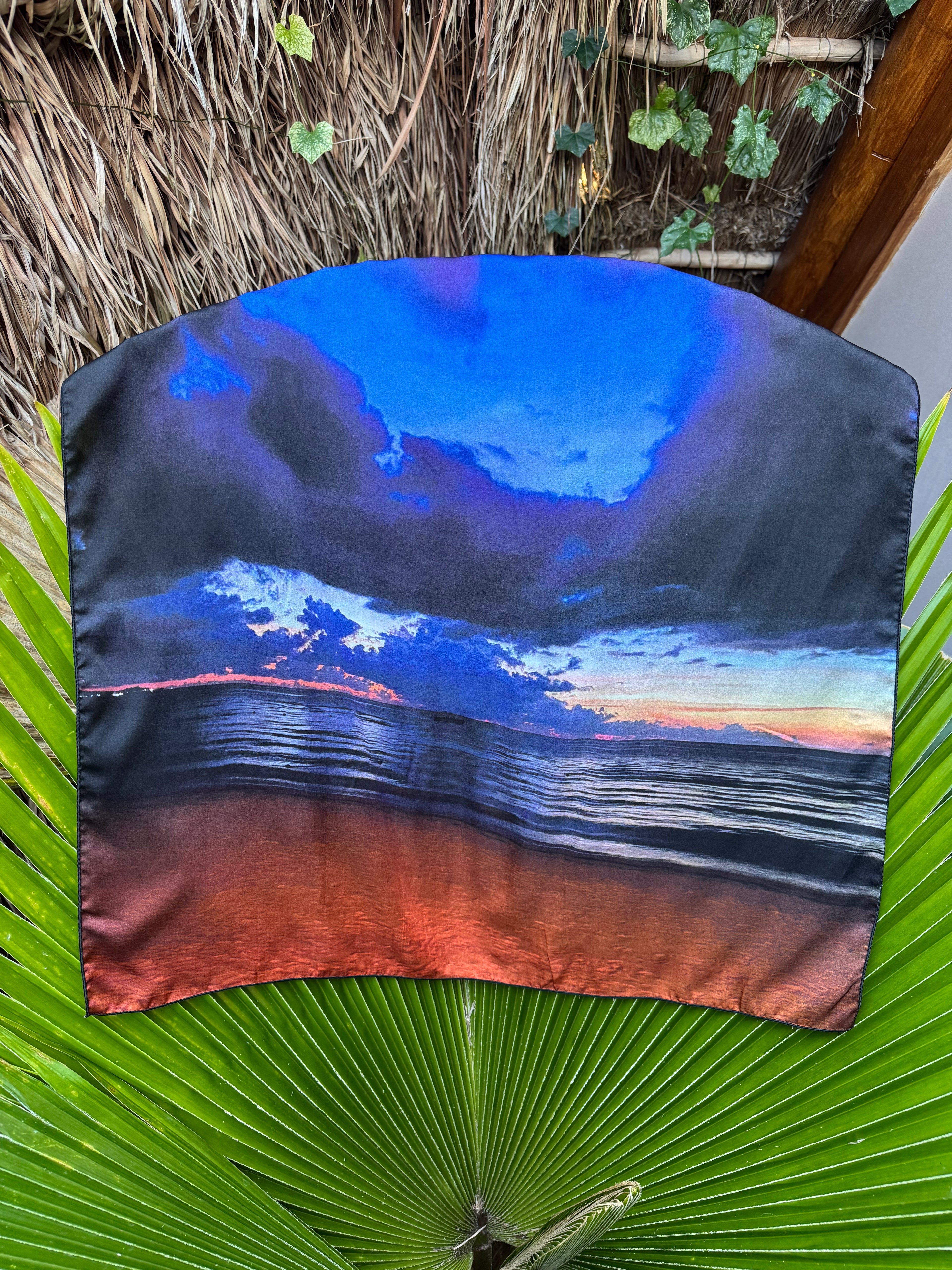 artistic, luxurious silk scarf with Jamaican sunset beach scene in blue and orange tones, made in Canada