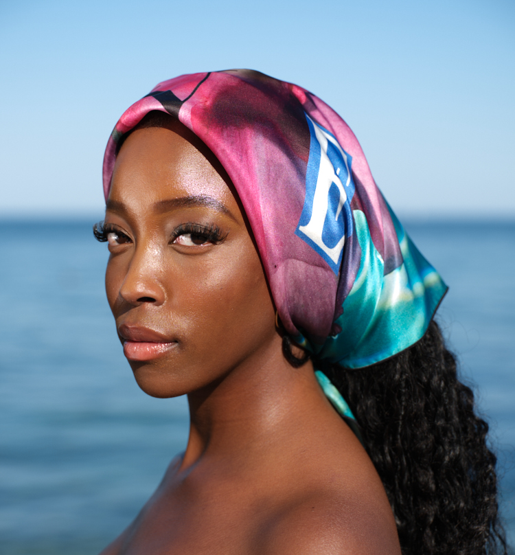 artistic, luxurious silk scarf featuring stunning pinks and blues with poetic collaged text, made in Canada