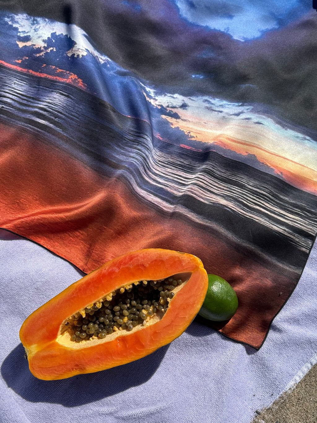 artistic, luxurious silk scarf with Jamaican sunset beach scene in blue and orange tones, made in Canada
